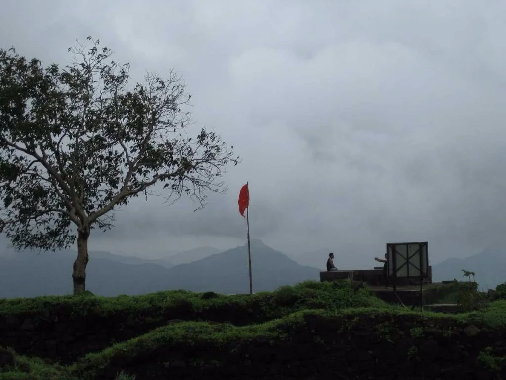 Red Flag Waving at the the top of Lohagad Fort Trek