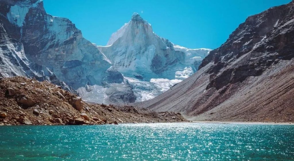 Stunning Lake Near Snow Mountains View at Kedartal Trek
